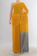 Yellow Kora Cotton Saree with Zari Butta on the body and Silk Border.  displayed on a mannequin