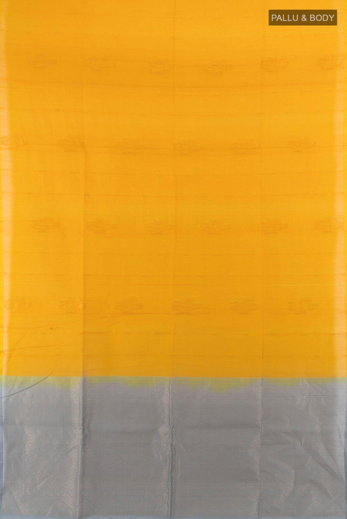 Flat view of Yellow Kora Cotton Saree with Zari Butta on the body and Silk Border. 