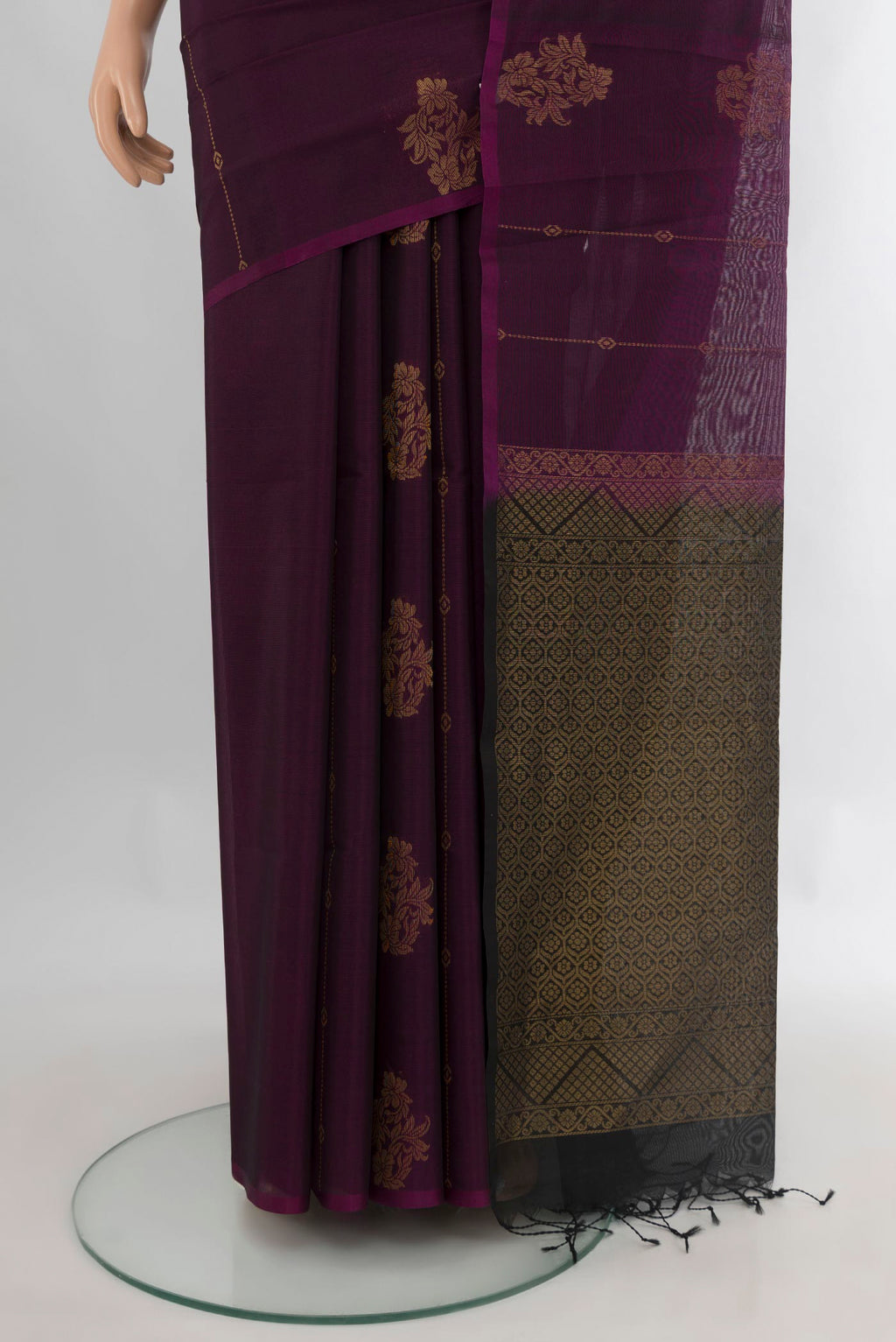 Pleats and pallu of Purple Silk Cotton Saree with Zari Butta on the body and Without Border. 