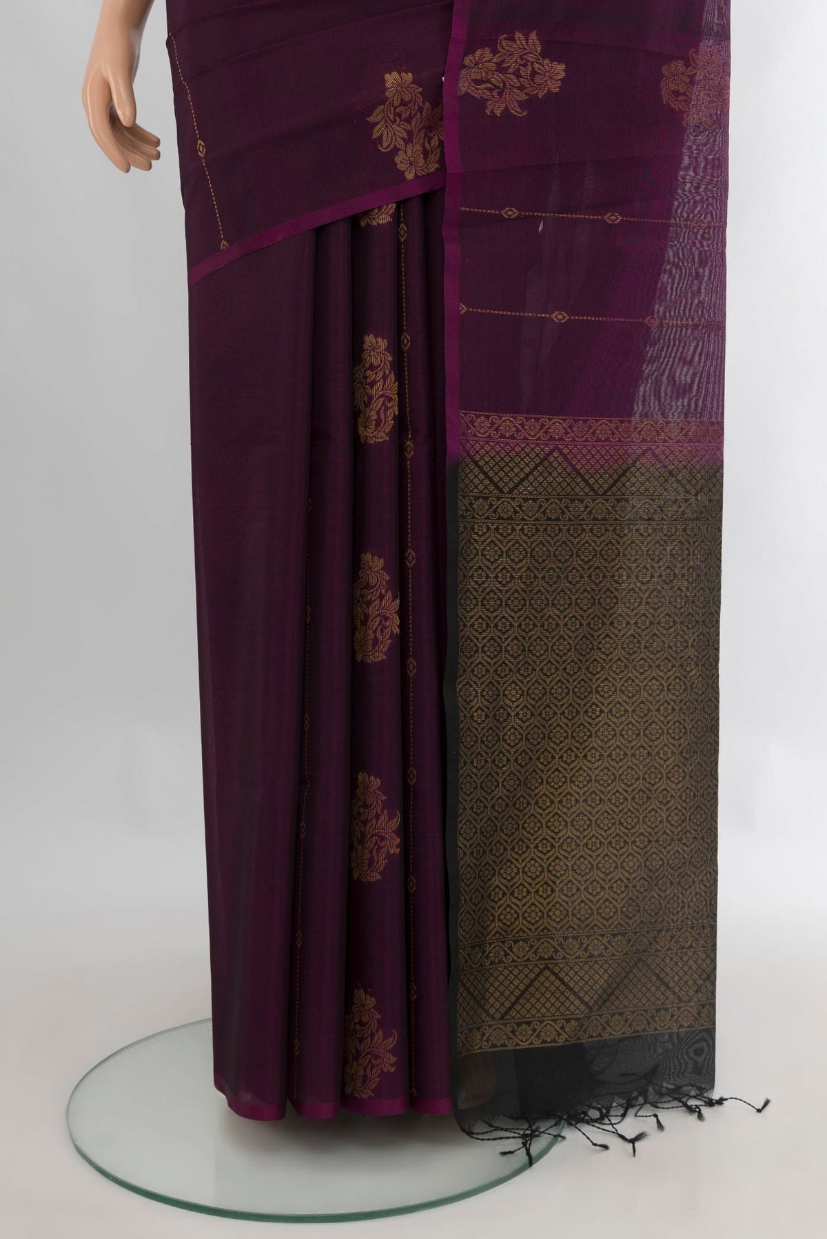 Pleats and pallu of Purple Silk Cotton Saree with Zari Butta on the body and Without Border. 