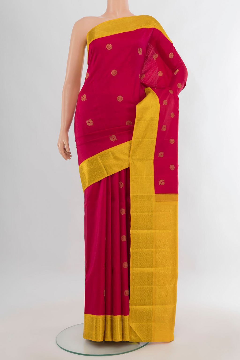 Pure Silk Red Kanchipuram Saree with Zari Butta on the body and Zari Border.  displayed on a mannequin