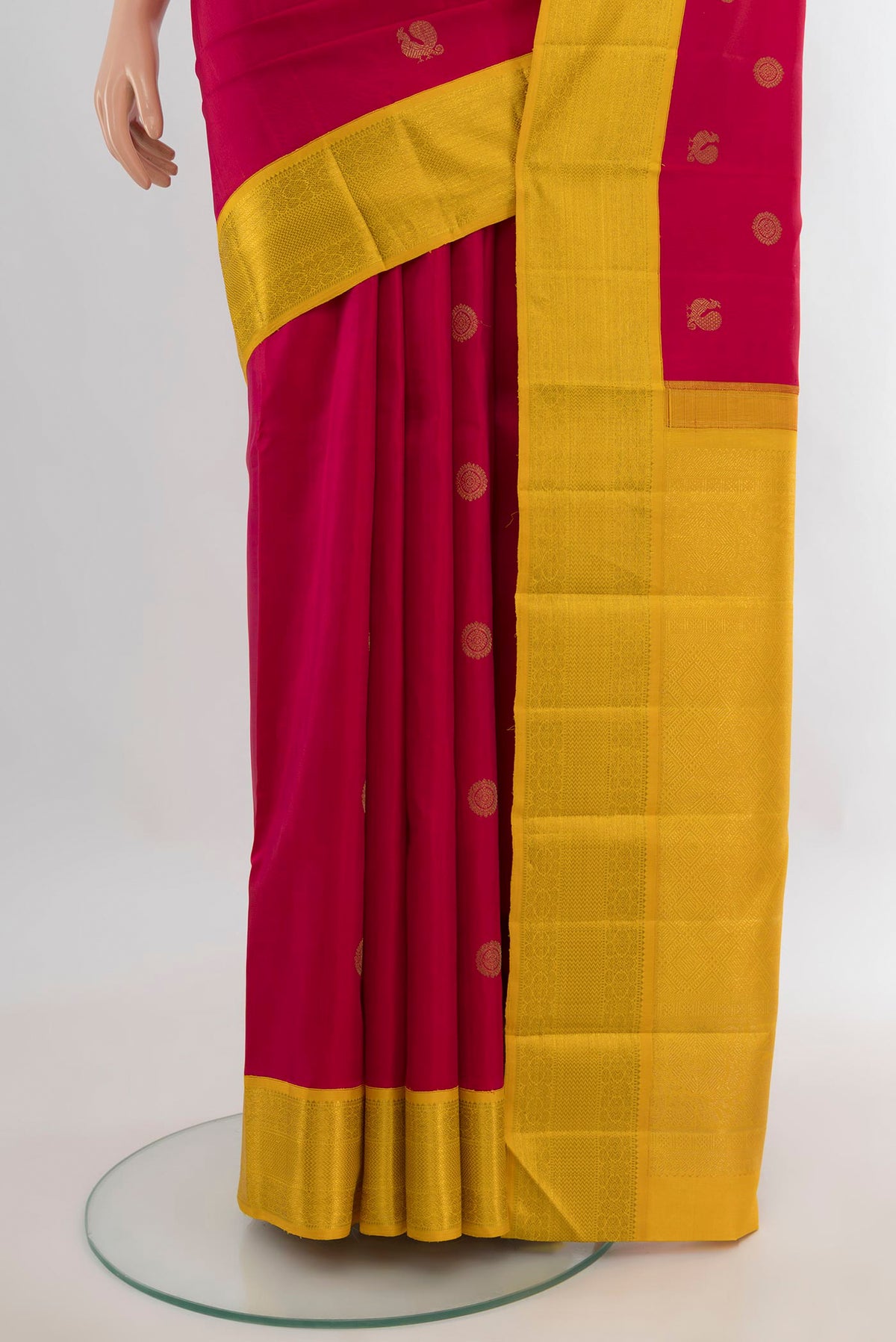Pleats and pallu of Pure Silk Red Kanchipuram Saree with Zari Butta on the body and Zari Border. 