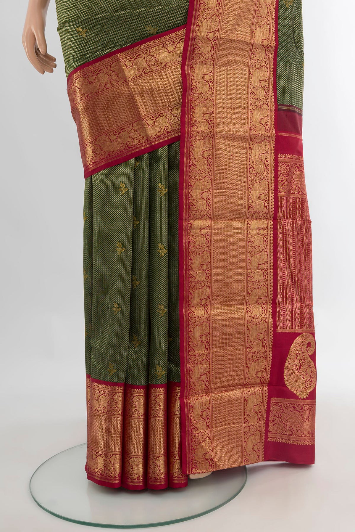 Pleats and pallu of Pure Silk Pure Zari Bottle Green Kanjivaram Saree with Zari Brocade on the body and Zari Border. 