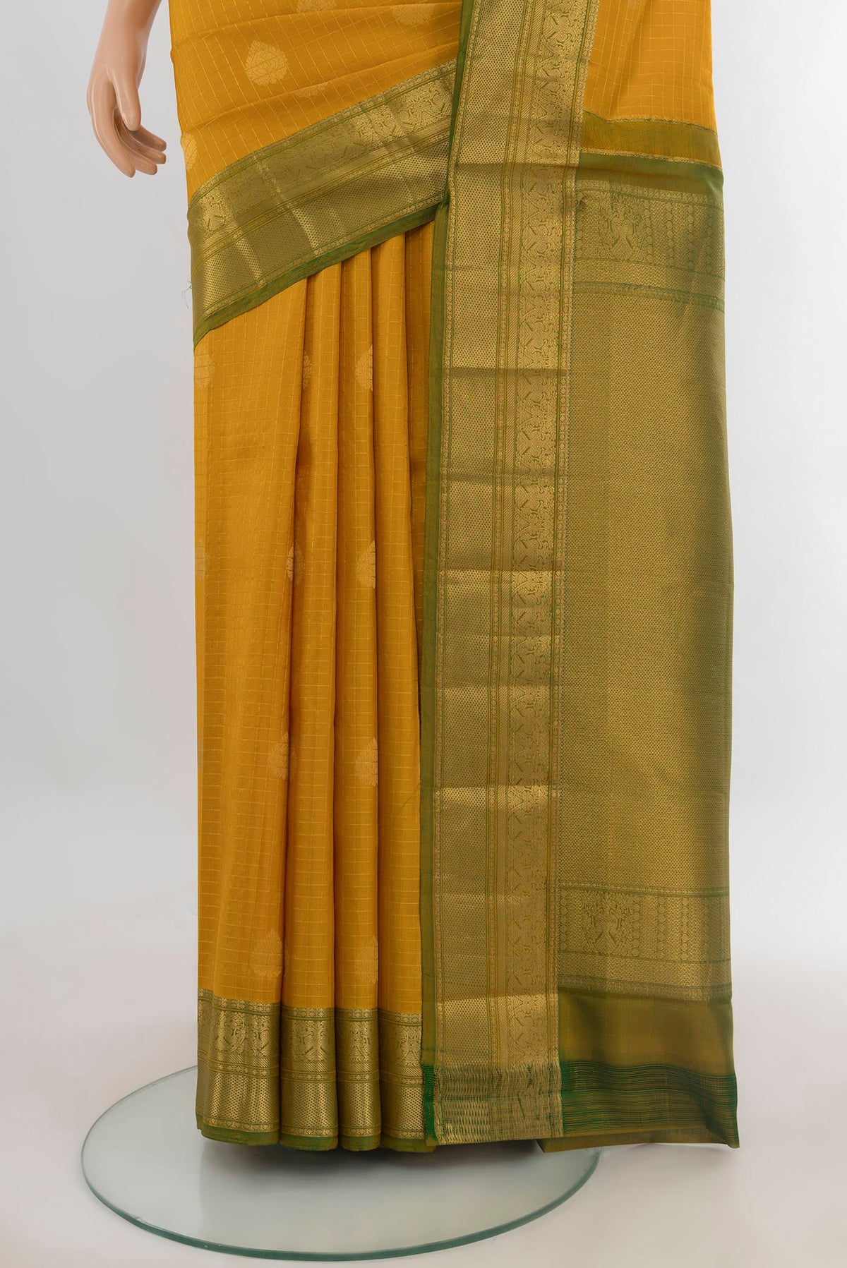 Pleats and pallu of Pure Silk Mustard Kanjivaram Saree with Zari Butta on the body and Zari Border. 