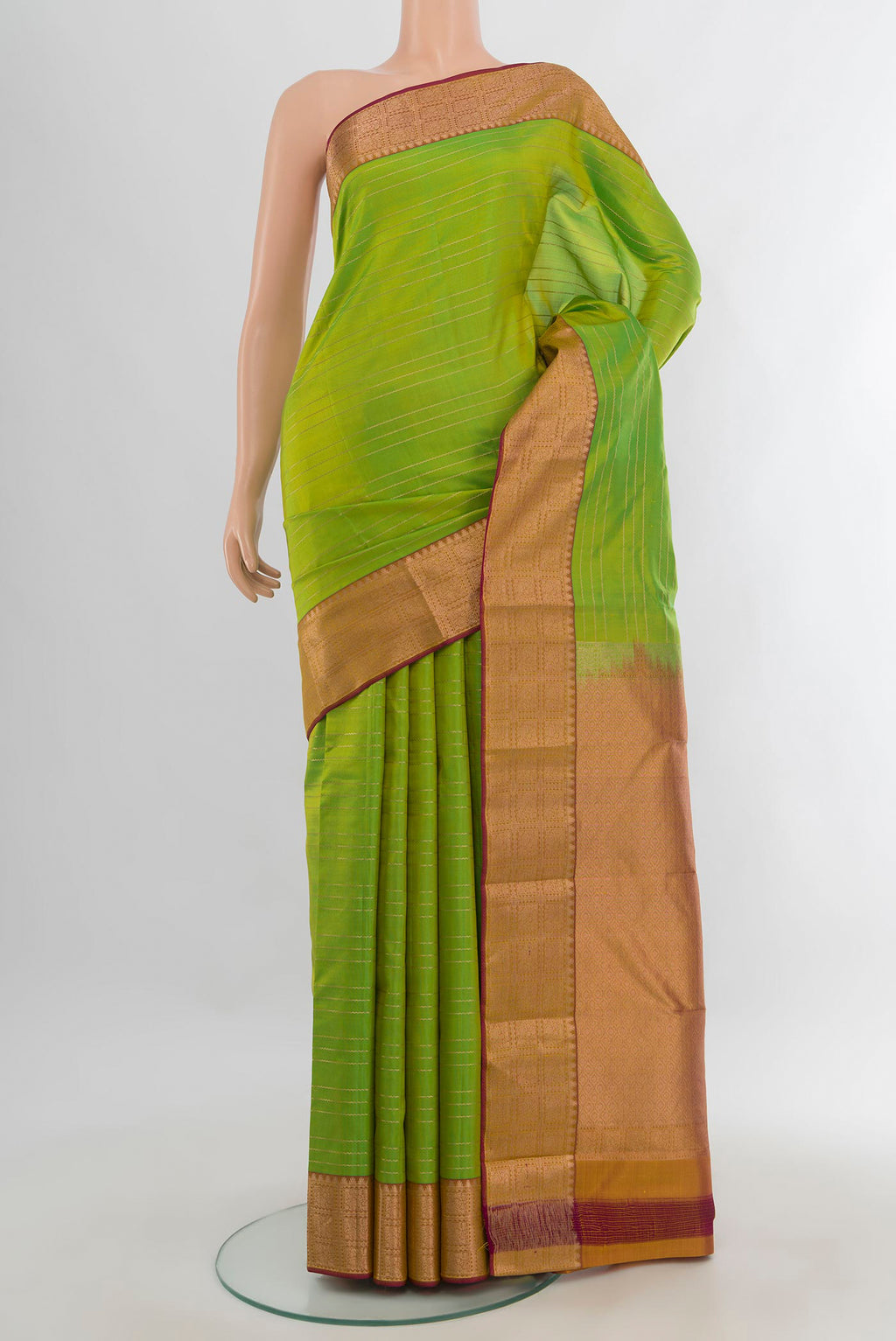 Pure Silk Parrot Green Kanchipuram Saree with Stripes on the body and Zari Border.  displayed on a mannequin