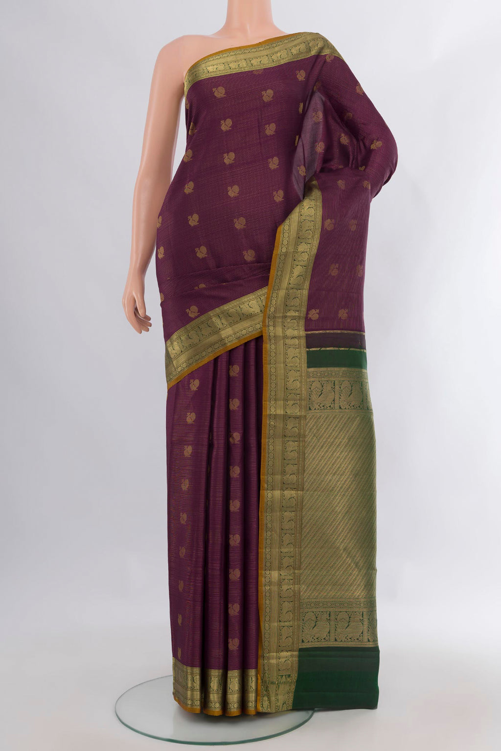 Pure Silk Purple Kanchipuram Saree with Zari Butta on the body and Zari Border.  displayed on a mannequin