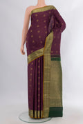 Pure Silk Purple Kanchipuram Saree with Zari Butta on the body and Zari Border.  displayed on a mannequin