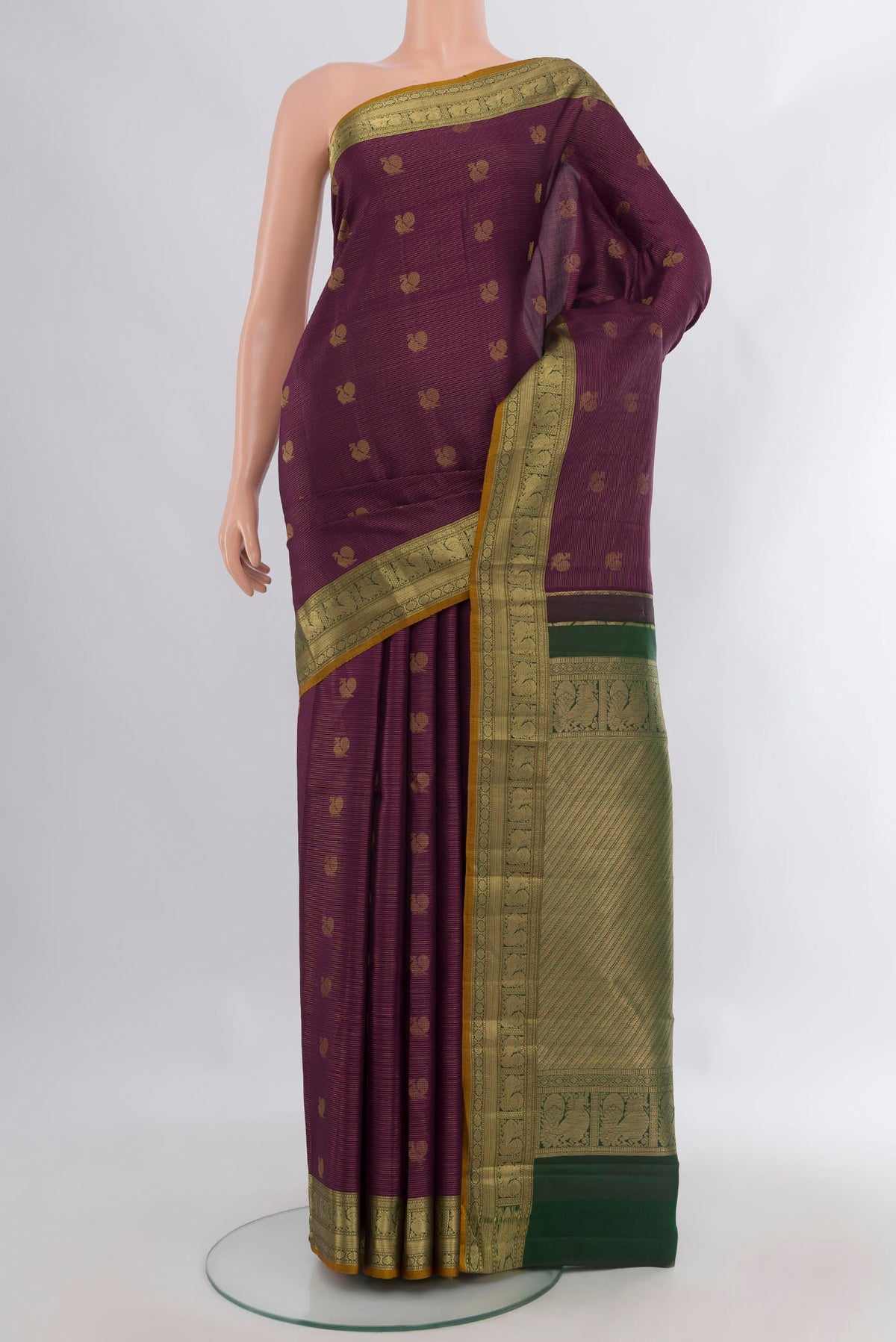 Pure Silk Purple Kanchipuram Saree with Zari Butta on the body and Zari Border.  displayed on a mannequin