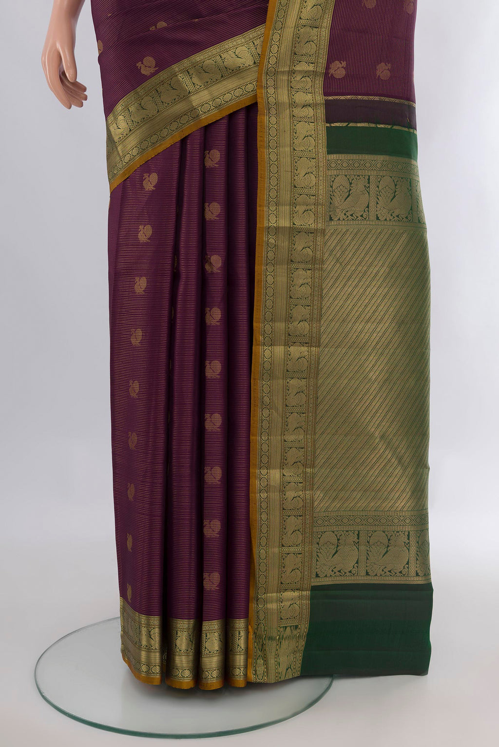 Pleats and pallu of Pure Silk Purple Kanchipuram Saree with Zari Butta on the body and Zari Border. 