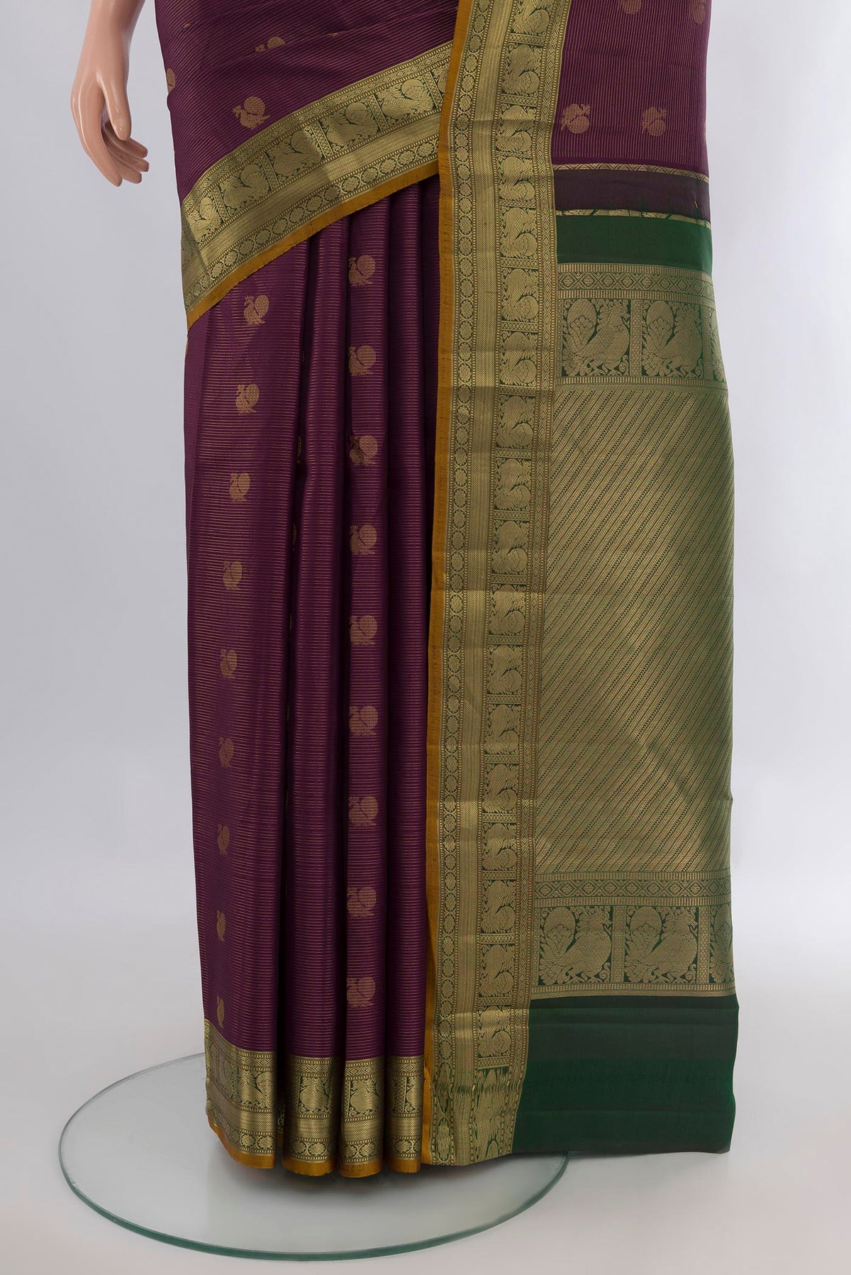 Pleats and pallu of Pure Silk Purple Kanchipuram Saree with Zari Butta on the body and Zari Border. 