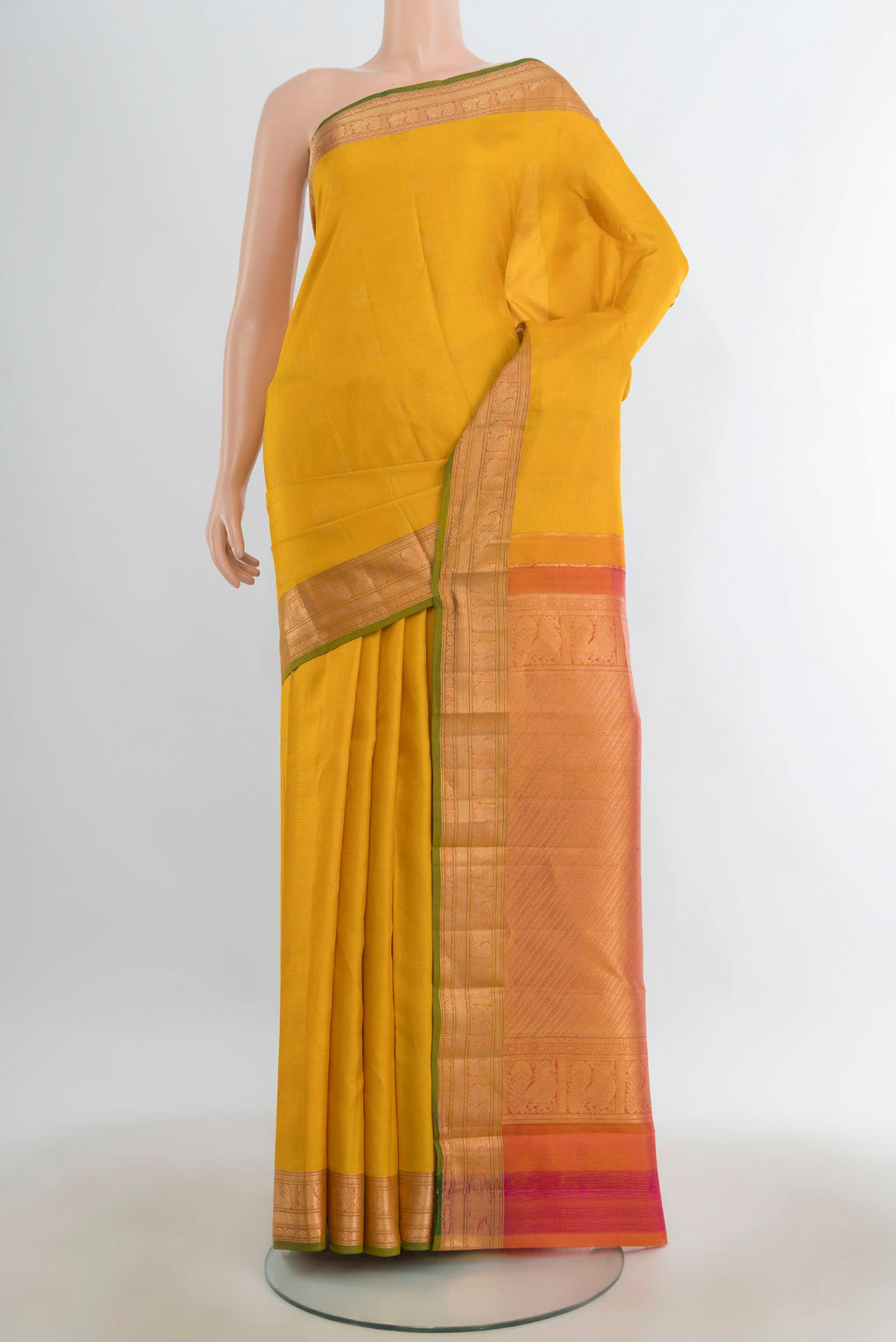 Pure Silk Mustard Kanchipuram Saree with Zari Butta on the body and Silk Border.  displayed on a mannequin