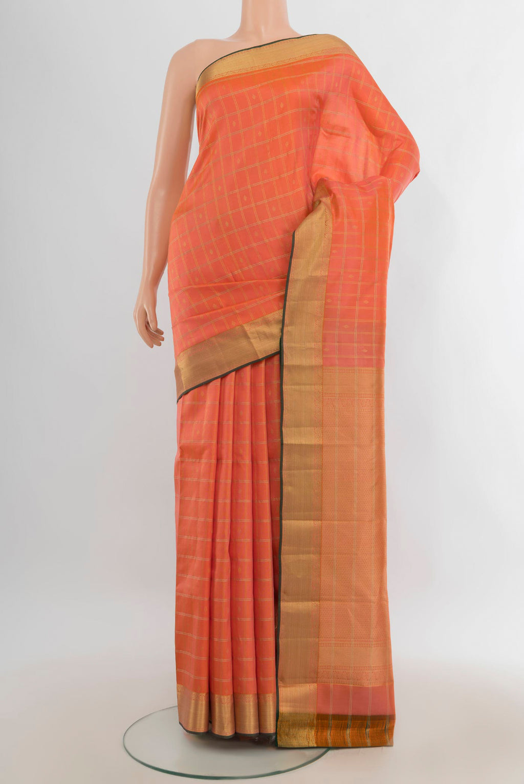 Pure Silk Rose Gold Kanchipuram Saree with Zari Butta on the body and Silk Border.  displayed on a mannequin