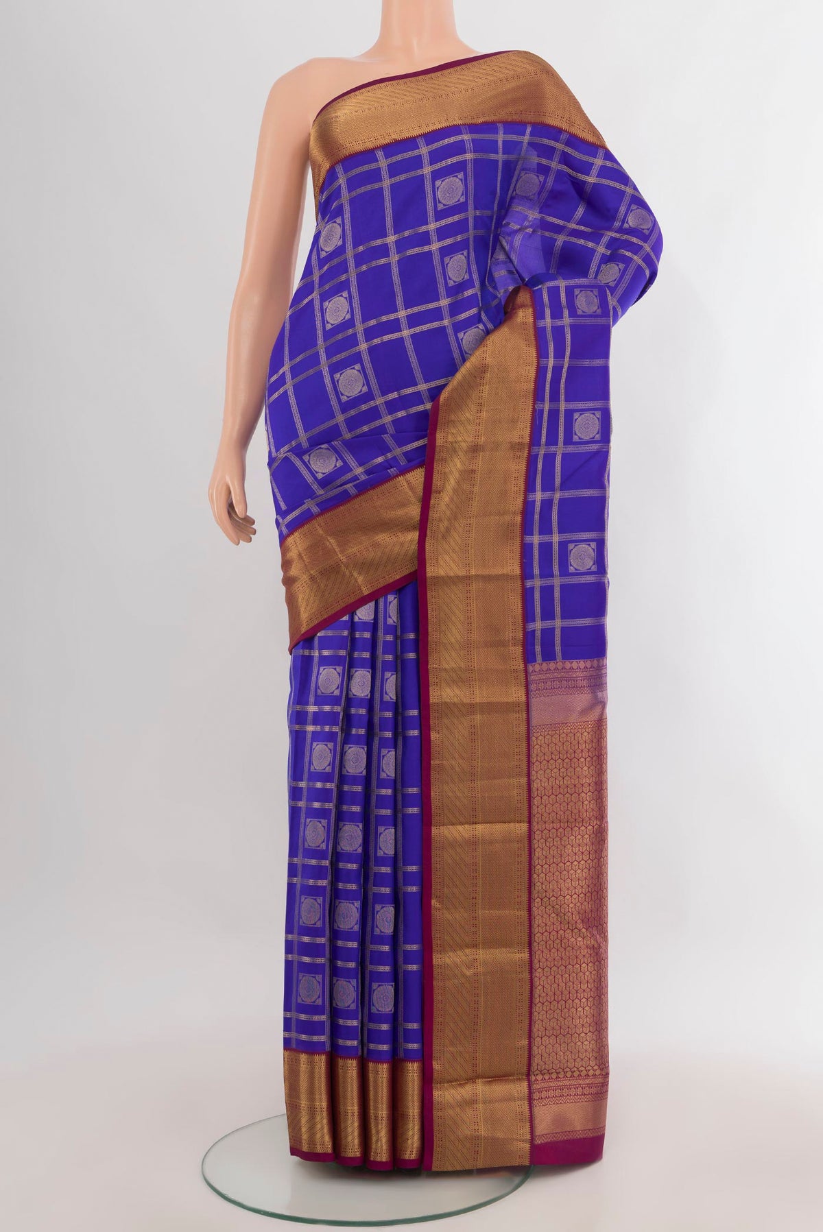 Pure Silk Dark Blue Kanchipuram Saree with Checked design on the body and Zari Border.  displayed on a mannequin