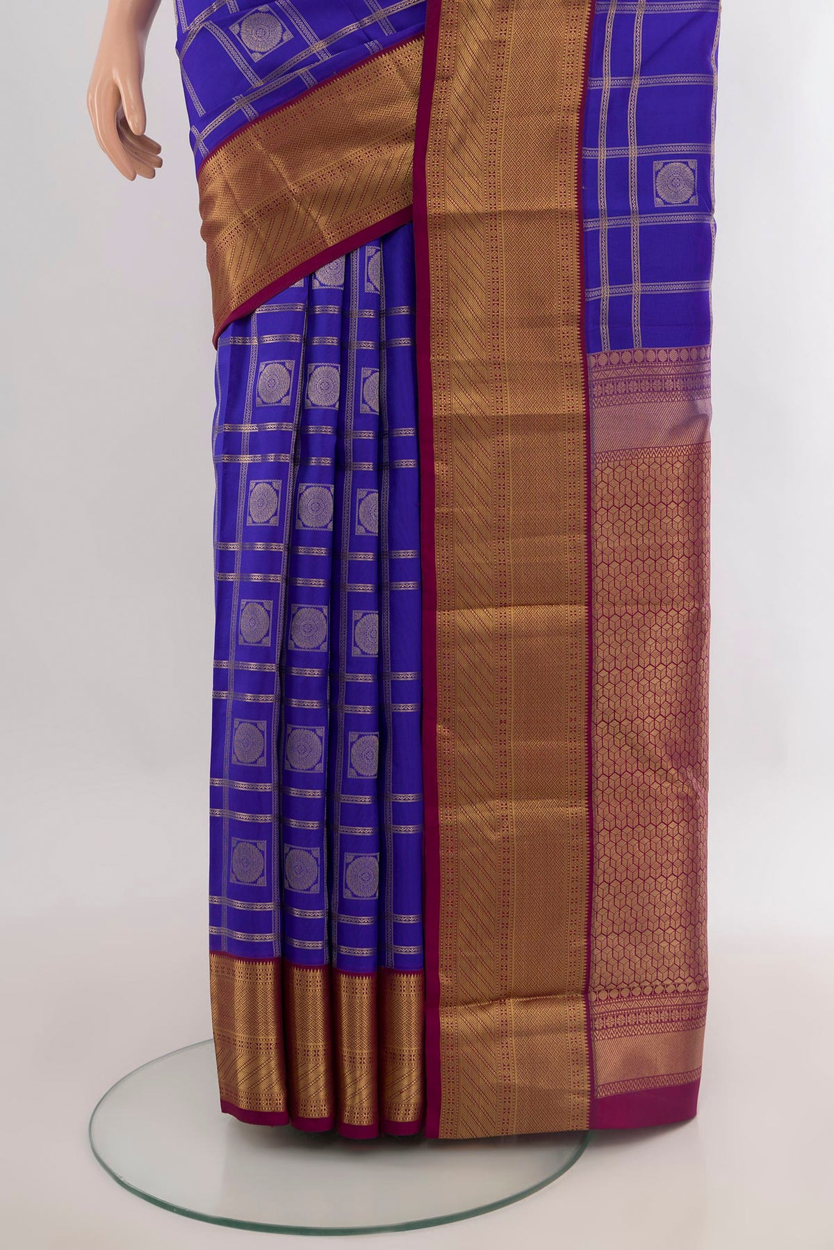 Pleats and pallu of Pure Silk Dark Blue Kanchipuram Saree with Checked design on the body and Zari Border. 