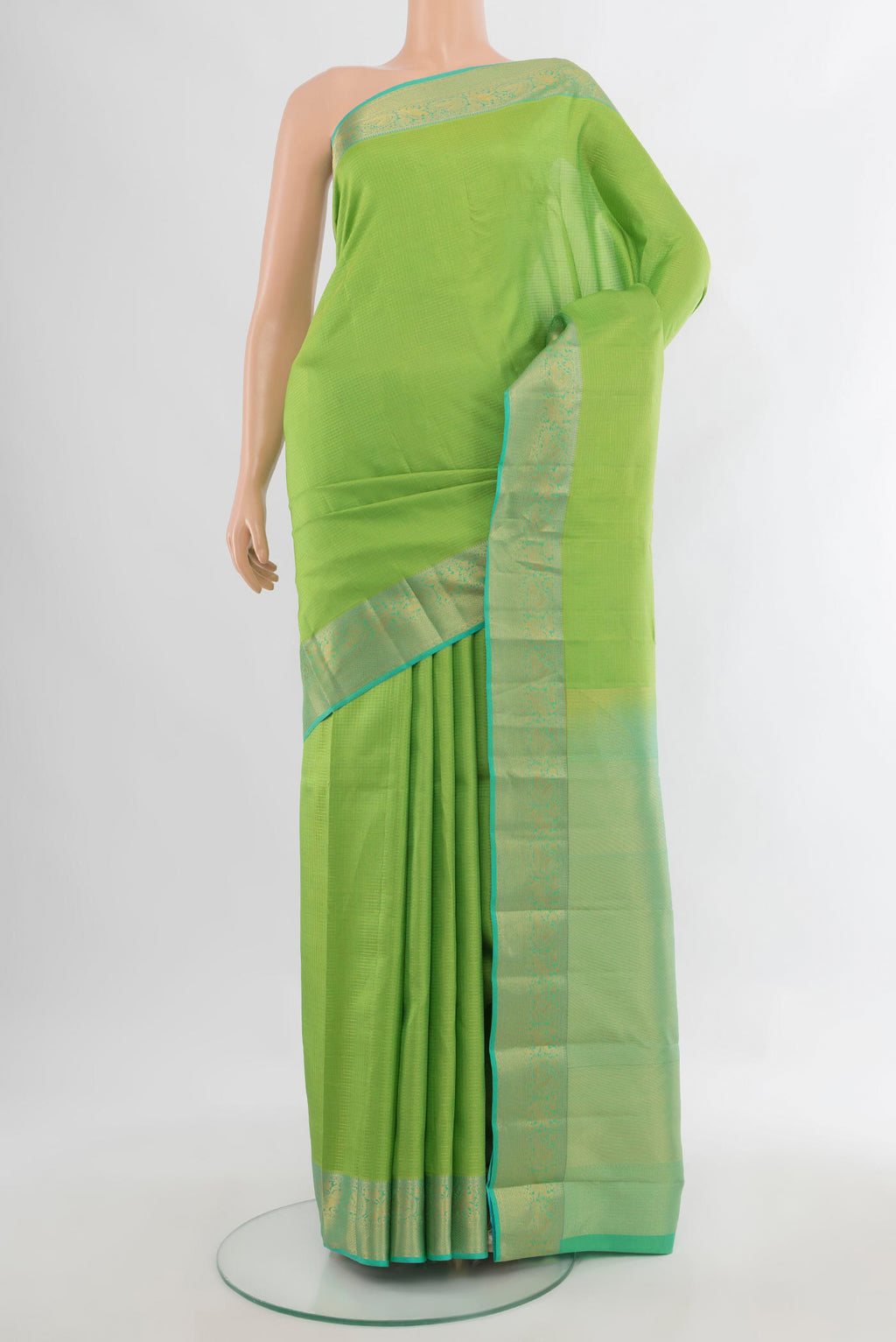 Pure Silk Parrot Green Kanchipuram Saree with Checked design on the body and Zari Border.  displayed on a mannequin