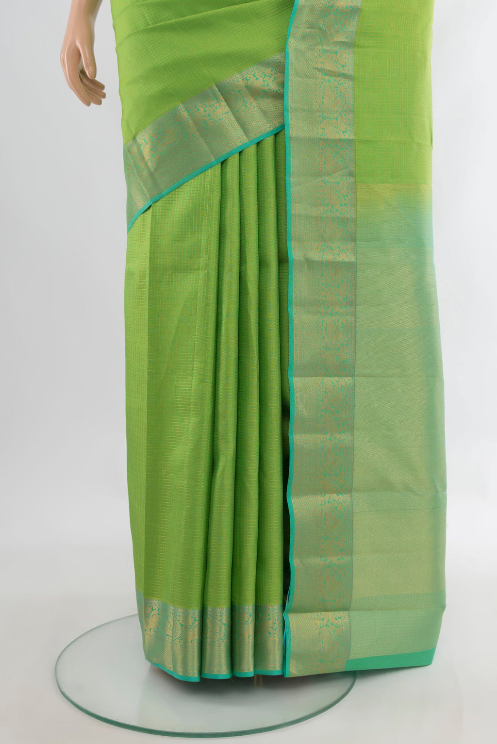Pleats and pallu of Pure Silk Parrot Green Kanchipuram Saree with Checked design on the body and Zari Border. 