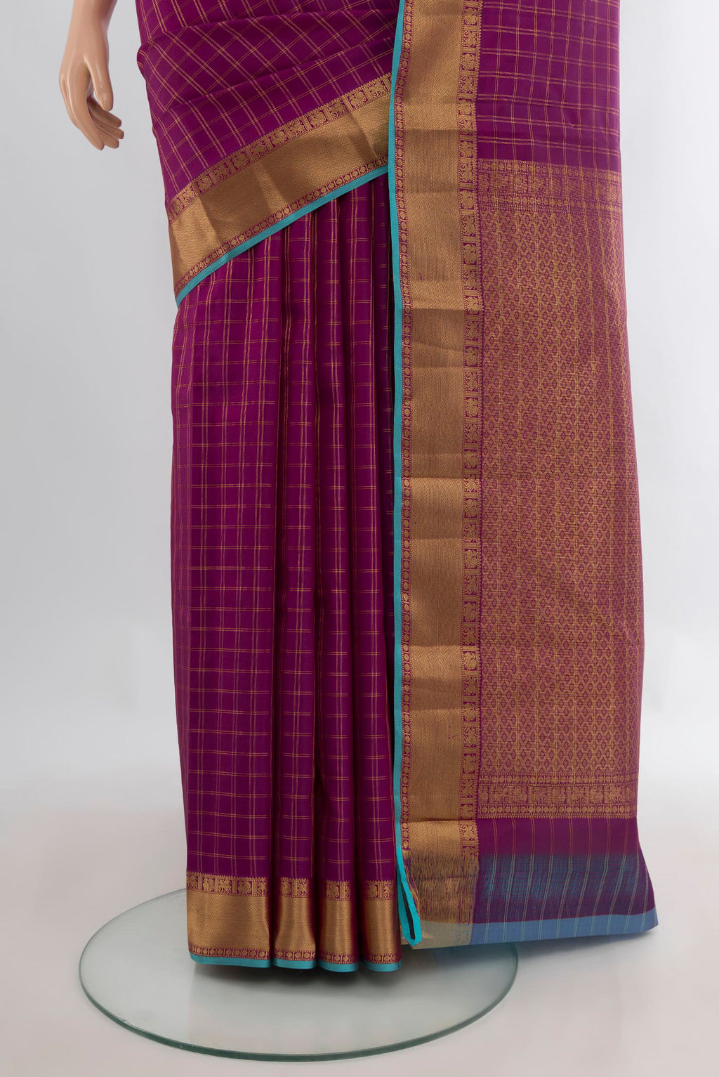 Pleats and pallu of Pure Silk Magenta Kanchipuram Saree with Checked design on the body and Zari Border. 