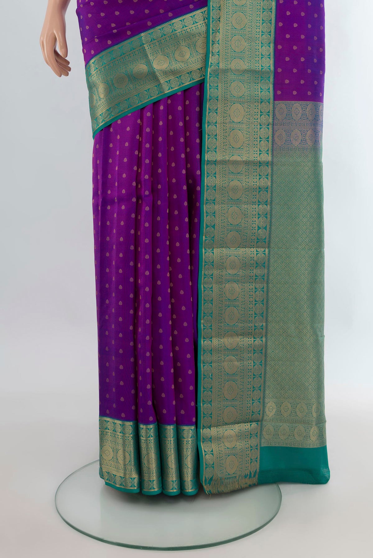 Pleats and pallu of Pure Silk Purple Kanchipuram Saree with Zari Butta on the body and Zari Border. 