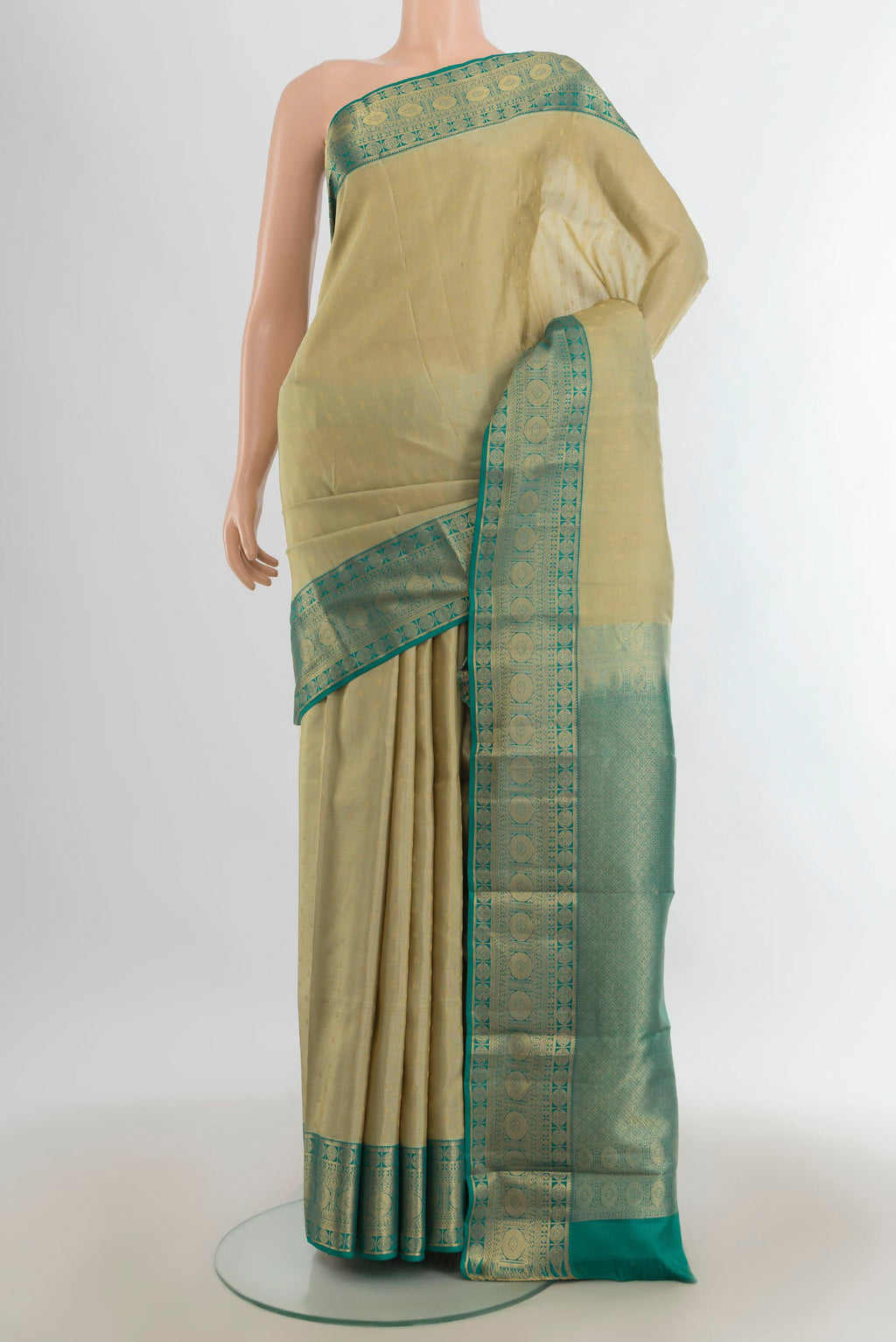 Pure Silk Olive Green Kanchipuram Saree with Zari Butta on the body and Silk Border.  displayed on a mannequin