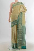 Pure Silk Olive Green Kanchipuram Saree with Zari Butta on the body and Silk Border.  displayed on a mannequin