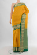 Pure Silk Mustard Kanchipuram Saree with Zari Butta on the body and Zari Border.  displayed on a mannequin