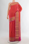 Pure Silk Brick Orange Kanjivaram Saree with Checked design on the body and Zari Border.  displayed on a mannequin