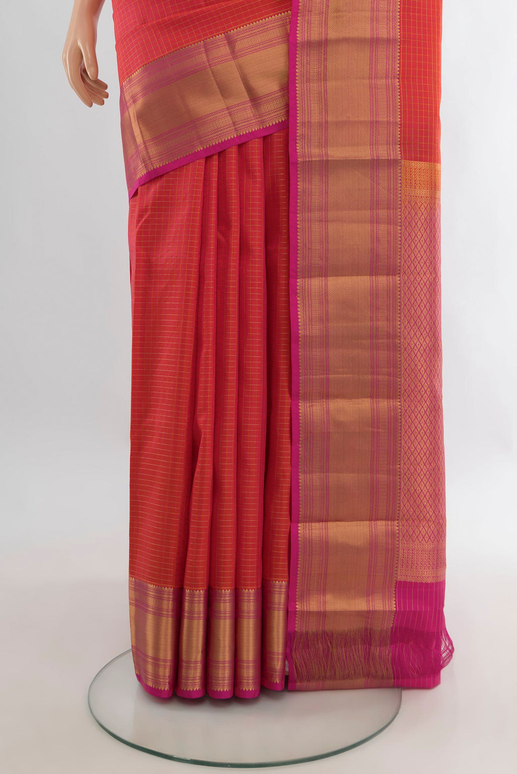 Pleats and pallu of Pure Silk Brick Orange Kanjivaram Saree with Checked design on the body and Zari Border. 