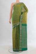 Pure Silk Light Green Kanchipuram Saree with Zari Butta on the body and Zari Border.  displayed on a mannequin
