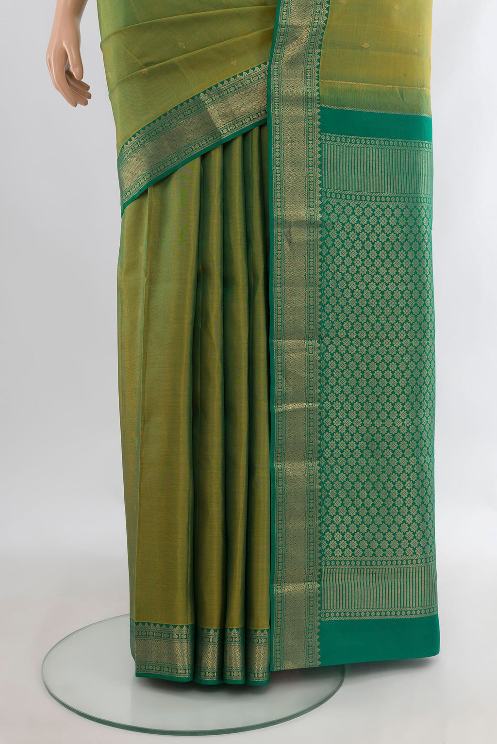 Pleats and pallu of Pure Silk Light Green Kanchipuram Saree with Zari Butta on the body and Zari Border. 