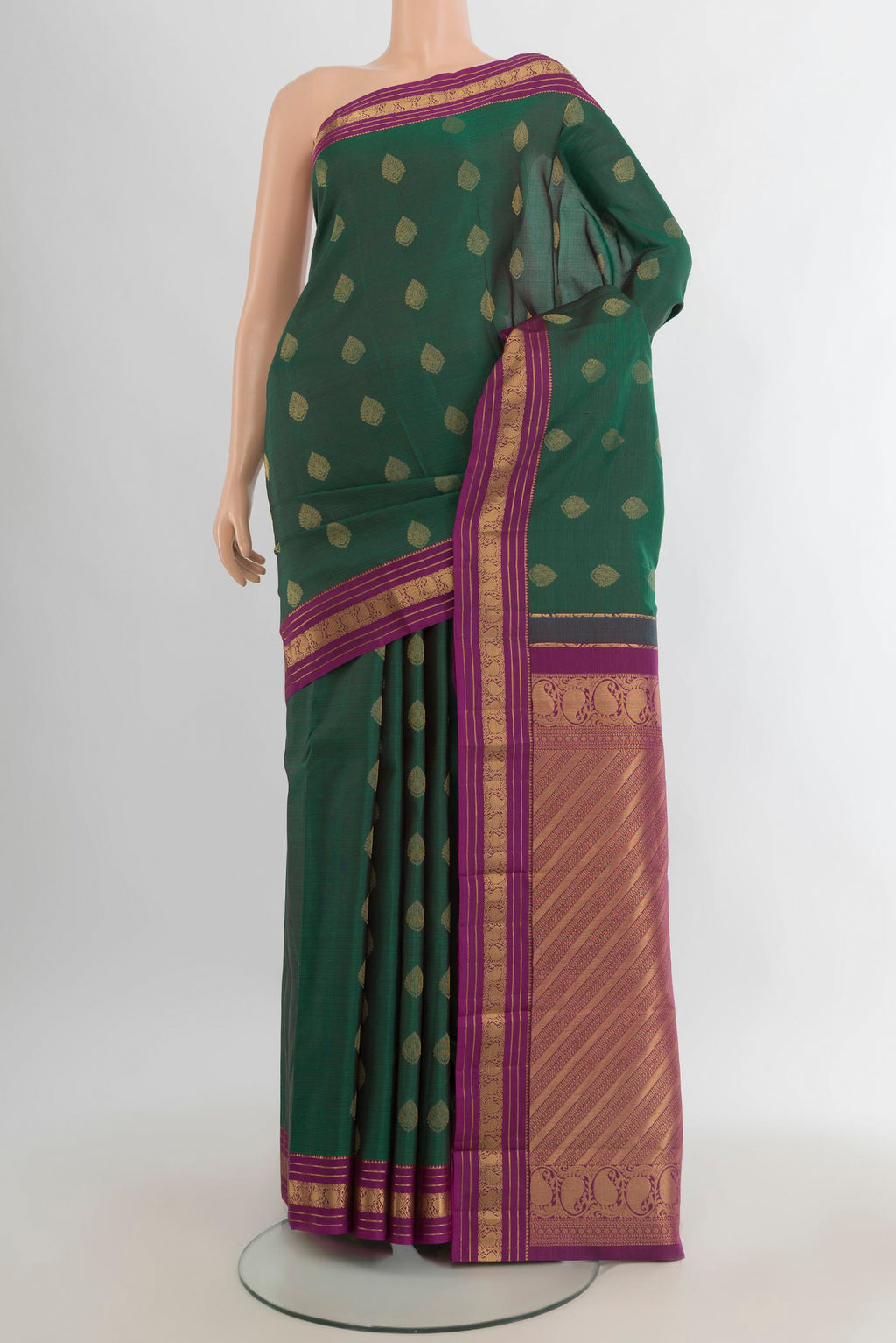 Pure Silk Bottle Green Kanchipuram Saree with Zari Butta on the body and Zari Border.  displayed on a mannequin