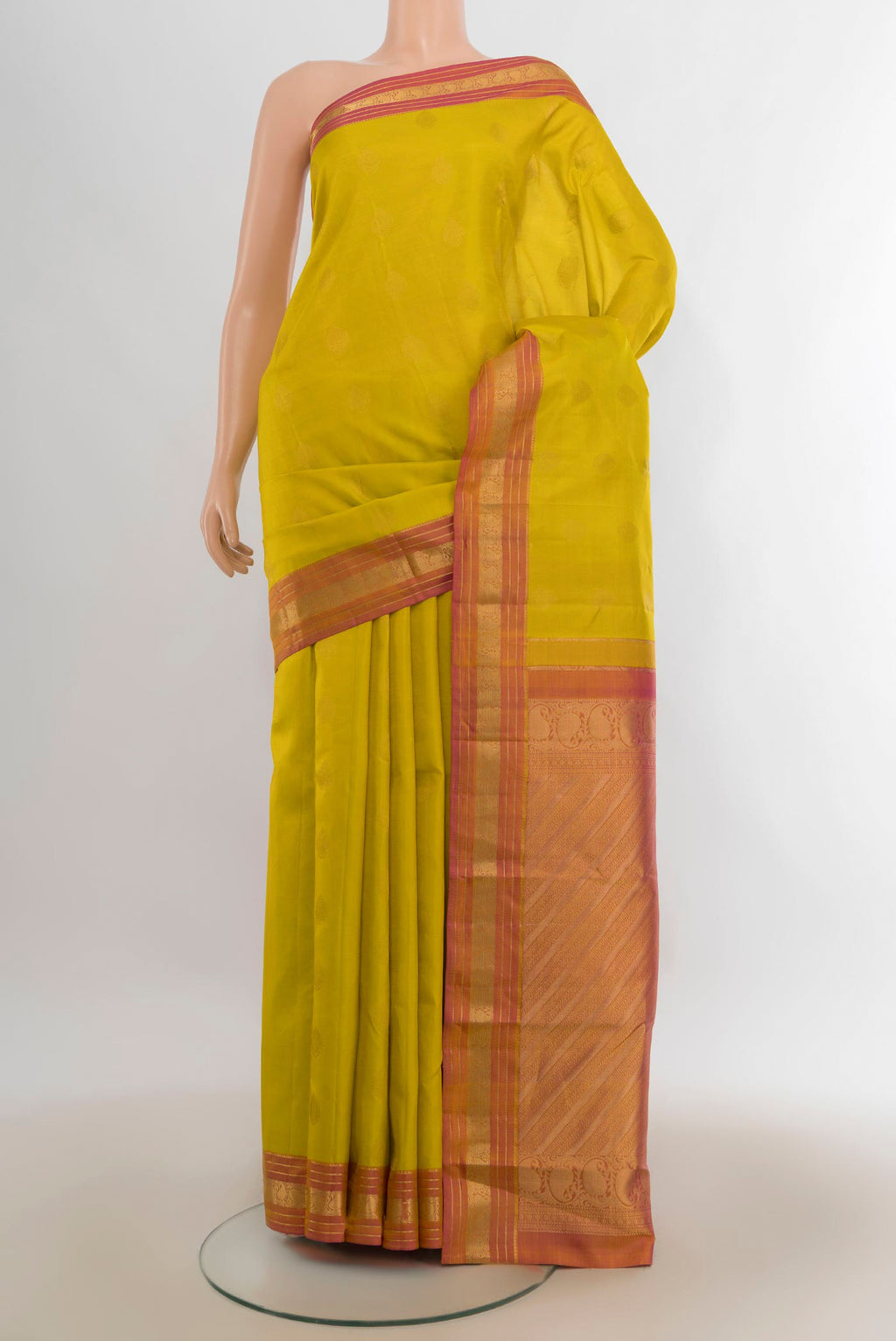 Pure Silk Yellow Kanchipuram Saree with Zari Butta on the body and Zari Border.  displayed on a mannequin