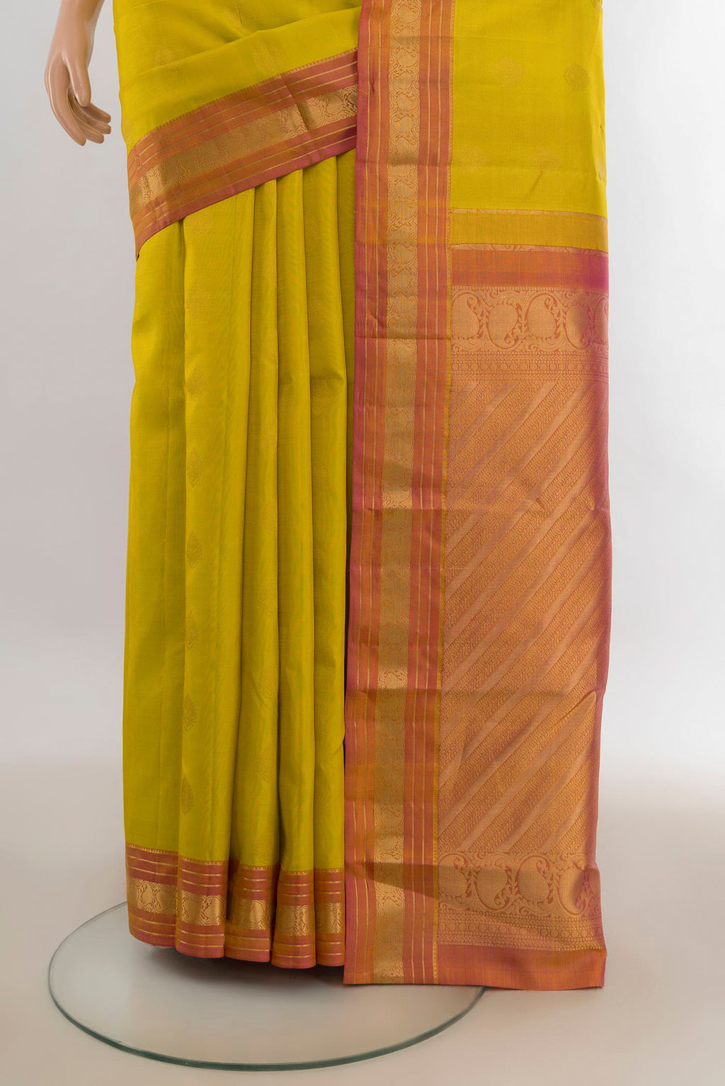 Pleats and pallu of Pure Silk Yellow Kanchipuram Saree with Zari Butta on the body and Zari Border. 