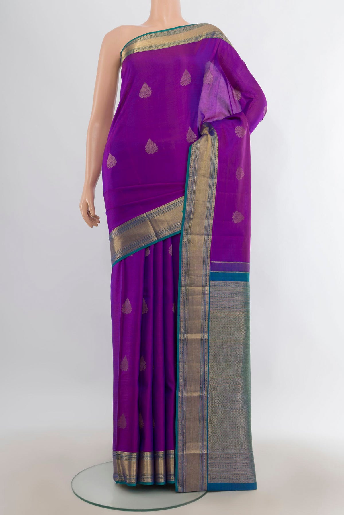 Pure Silk Purple Kanchipuram Saree with Zari Butta on the body and Zari Border.  displayed on a mannequin