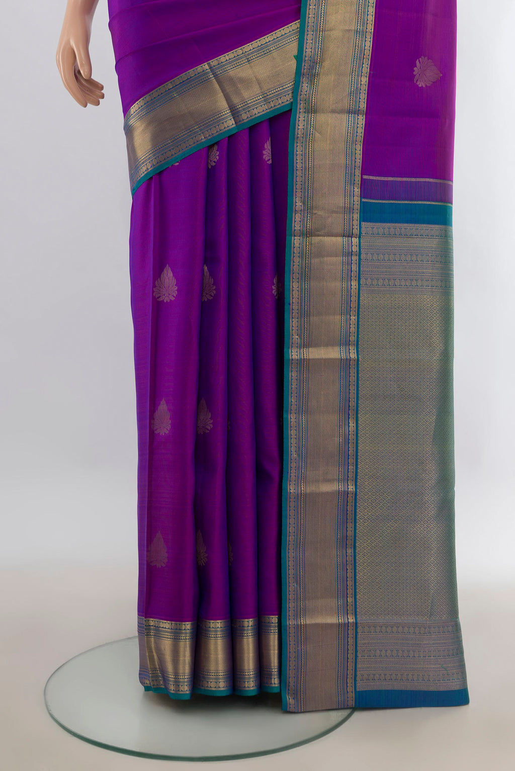 Pleats and pallu of Pure Silk Purple Kanchipuram Saree with Zari Butta on the body and Zari Border. 