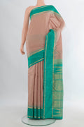 Pure Silk Beige Kanchipuram Saree with Checked design on the body and Plain Border.  displayed on a mannequin