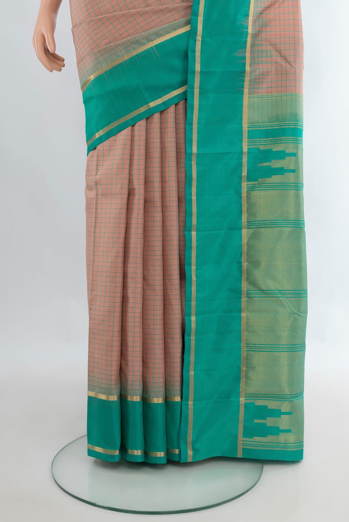 Pleats and pallu of Pure Silk Beige Kanchipuram Saree with Checked design on the body and Plain Border. 