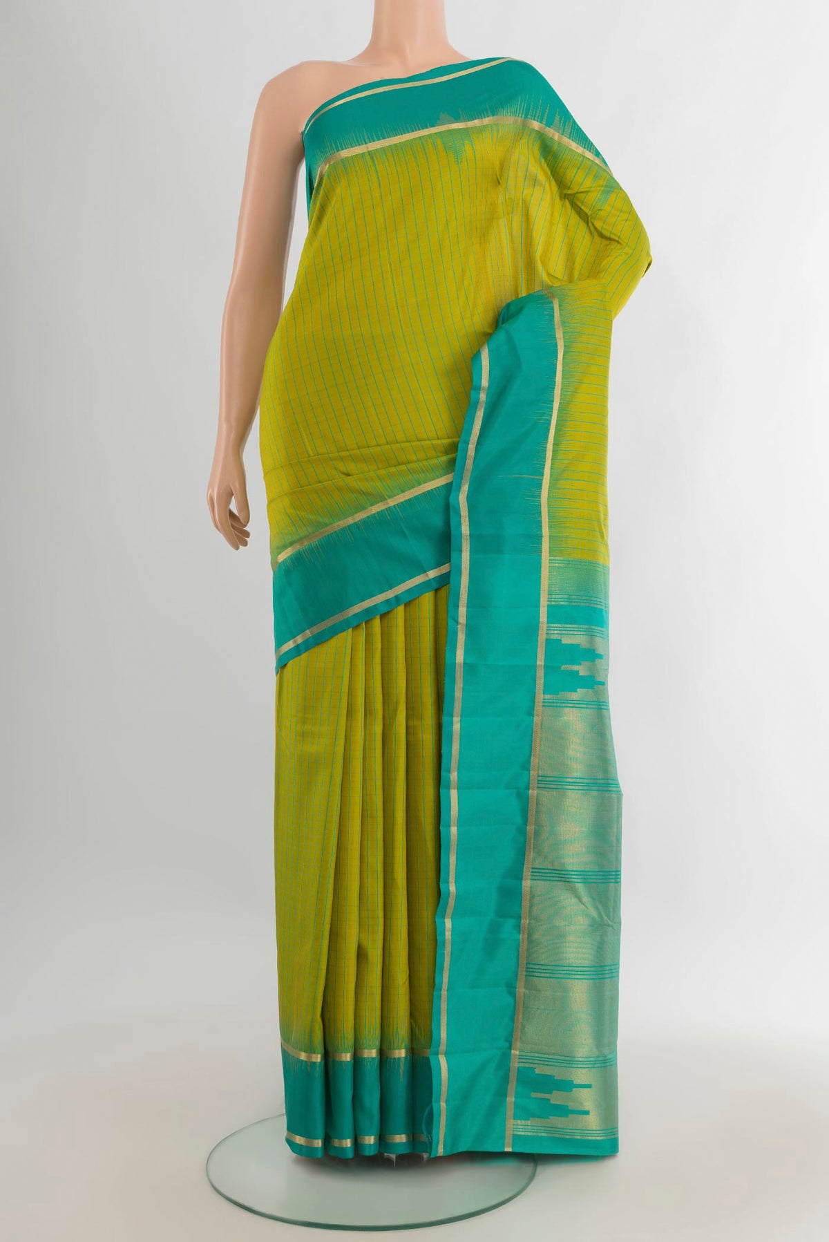 Pure Silk Parrot Green Kanchipuram Saree with Checked design on the body and Plain Border.  displayed on a mannequin