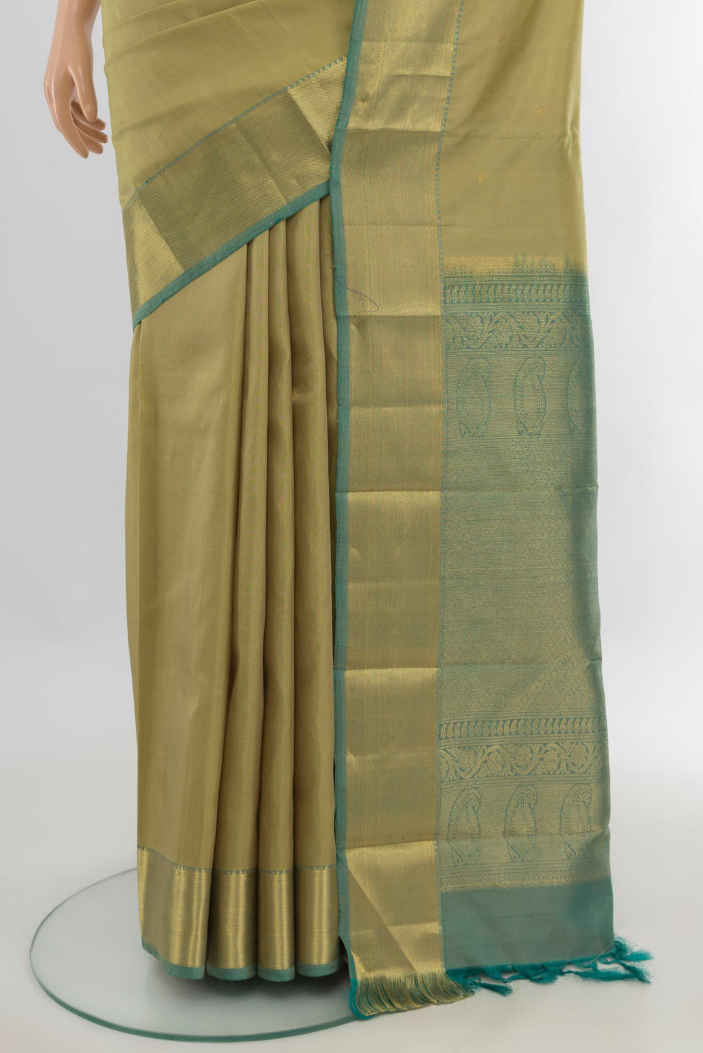 Pleats and pallu of Pure Silk Olive Green Kanchipuram Saree with Zari Butta on the body and Zari Border. 