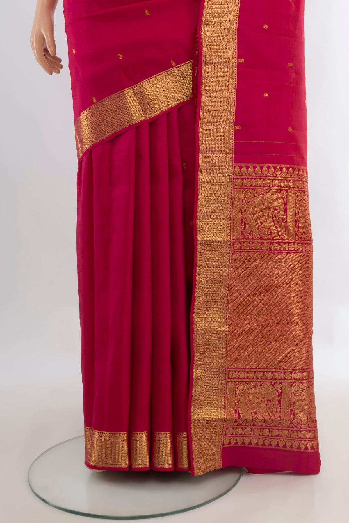 Pleats and pallu of Pure Silk Dark Pink Kanjivaram Saree with Zari Butta on the body and Zari Border. 