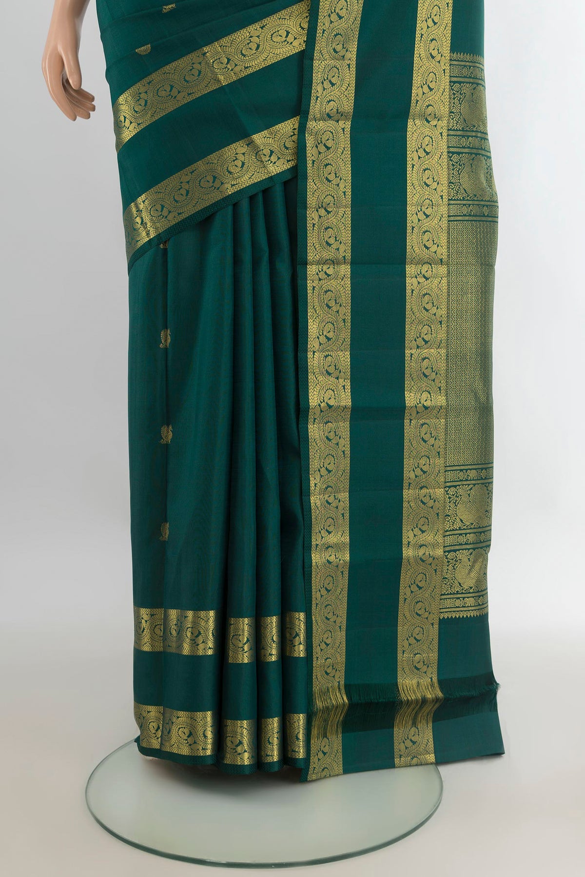 Pleats and pallu of Pure Silk Bottle Green Kanjivaram Saree with Zari Butta on the body and Zari Border. 