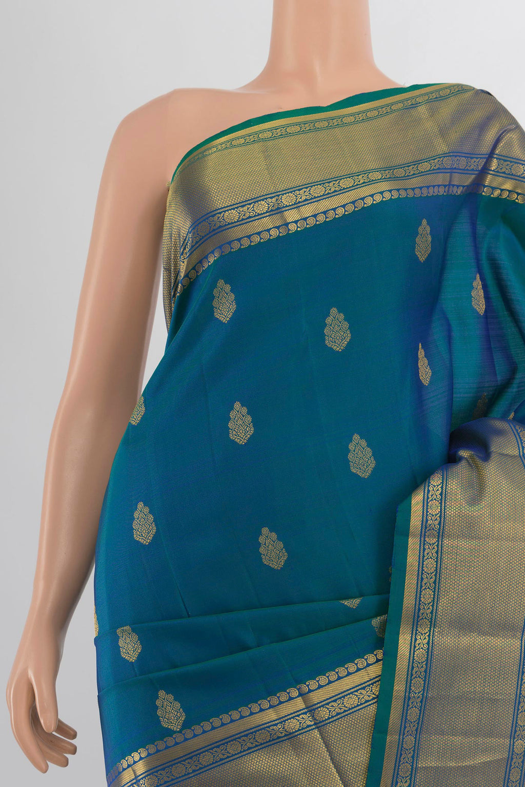 Border image of Pure Silk Peacock Blue Kanjivaram Saree with Zari Butta on the body and Silk Border. 