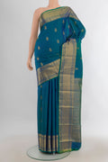 Pure Silk Peacock Blue Kanjivaram Saree with Zari Butta on the body and Silk Border.  displayed on a mannequin