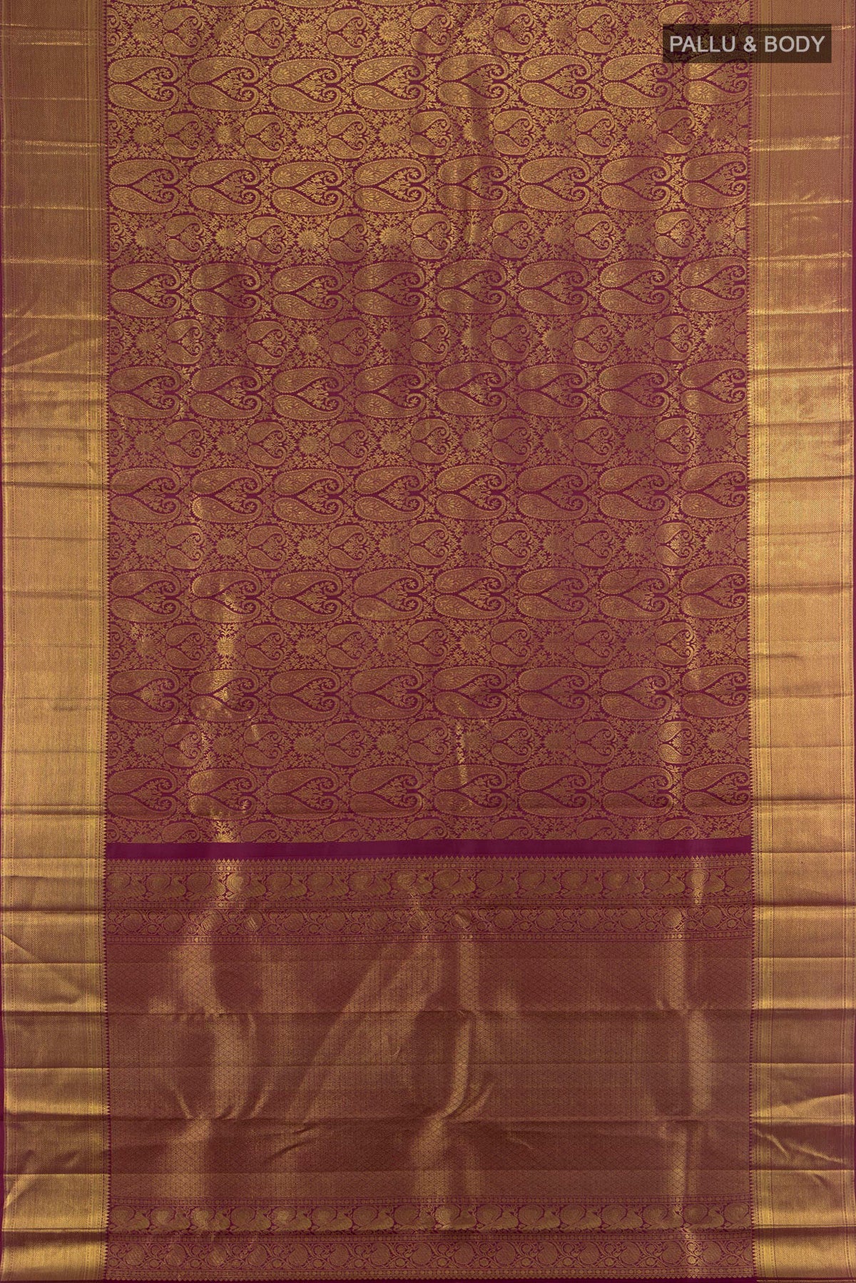 Flat view of Pure Silk Maroon Kanchipuram Saree with Zari Butta on the body and Silk Border. 