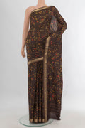 Pure Silk Coffee Brown Printed Saree with Floral Print on the body and Zari Border.  displayed on a mannequin