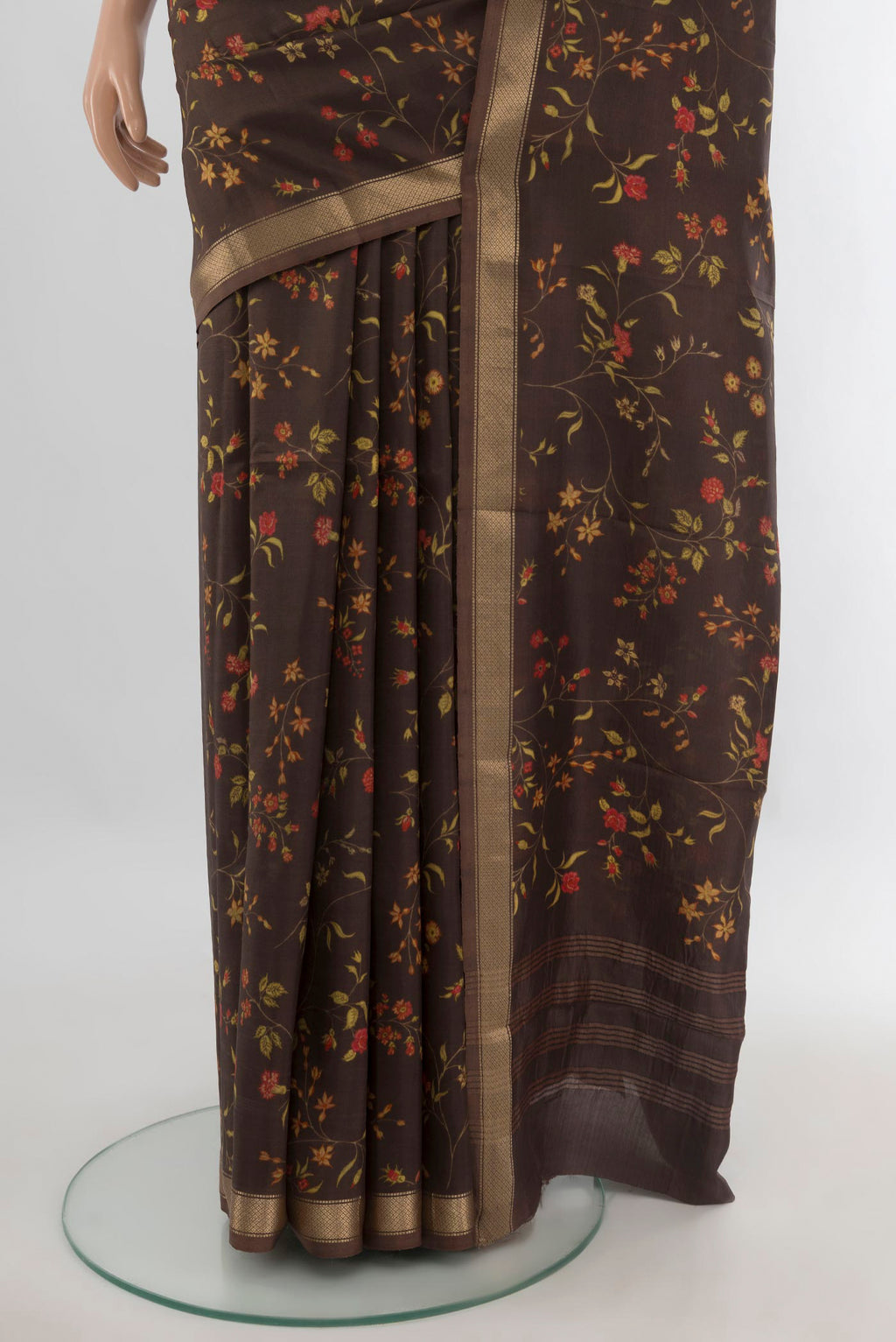 Pleats and pallu of Pure Silk Coffee Brown Printed Saree with Floral Print on the body and Zari Border. 