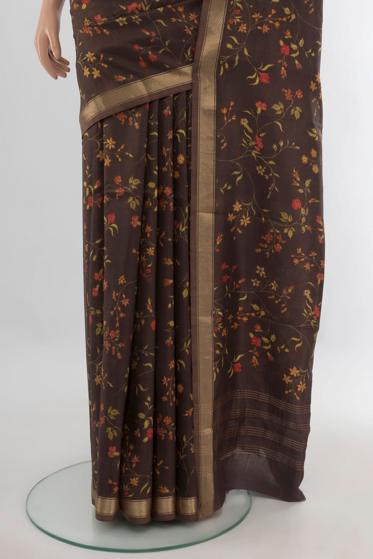 Pleats and pallu of Pure Silk Coffee Brown Printed Saree with Floral Print on the body and Zari Border. 