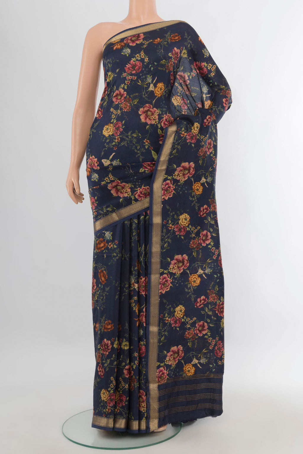 Pure Silk Navy Blue Printed Saree with Floral Print on the body and Zari Border.  displayed on a mannequin