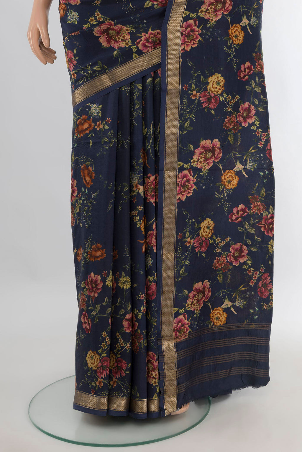 Pleats and pallu of Pure Silk Navy Blue Printed Saree with Floral Print on the body and Zari Border. 