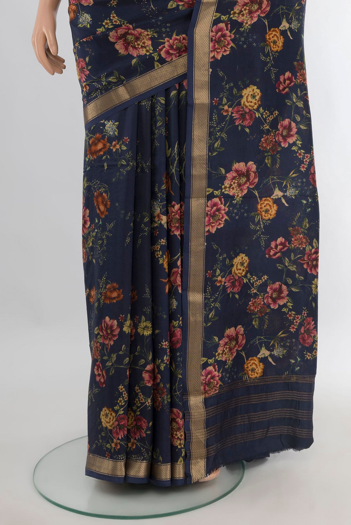 Pleats and pallu of Pure Silk Navy Blue Printed Saree with Floral Print on the body and Zari Border. 