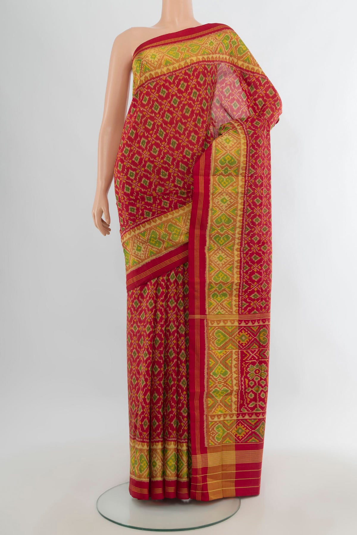 Pure Silk Red Rajkot Patola Saree with Pure Ikat on the body and Ikat Border.  displayed on a mannequin
